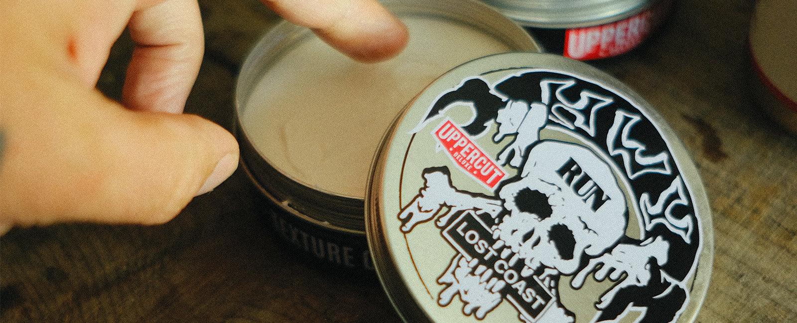 HWYxUCD tin open with hand about to take some product